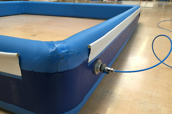 Oppblåsbare tetninger for sikker tømming av lastebiler