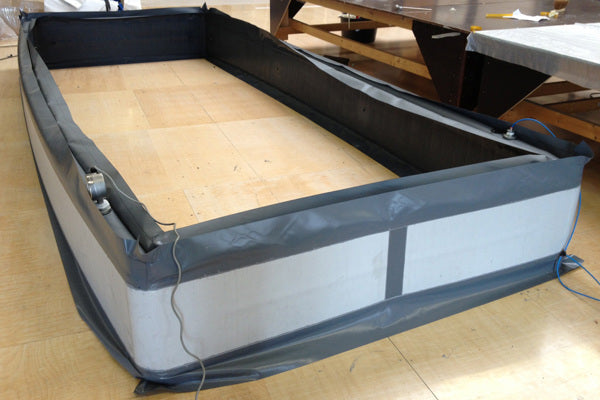 Oppblåsbare tetninger for sikker tømming av lastebiler